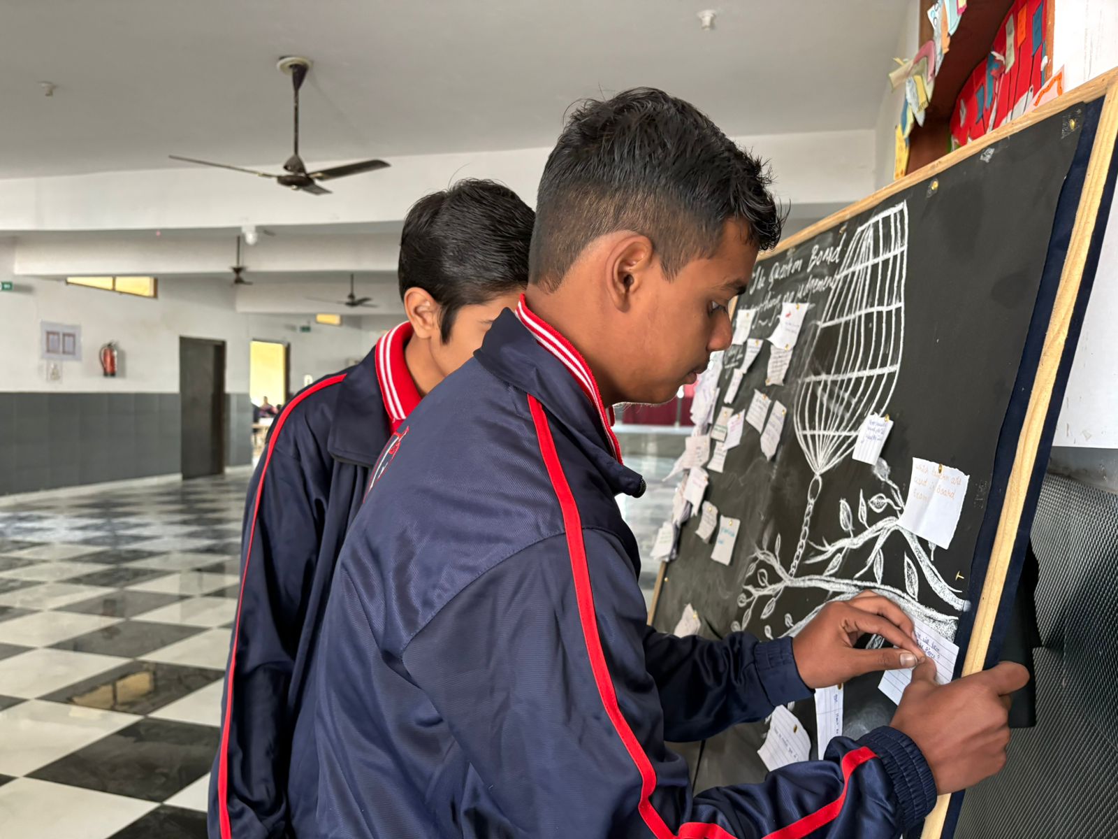 Students working on a science display