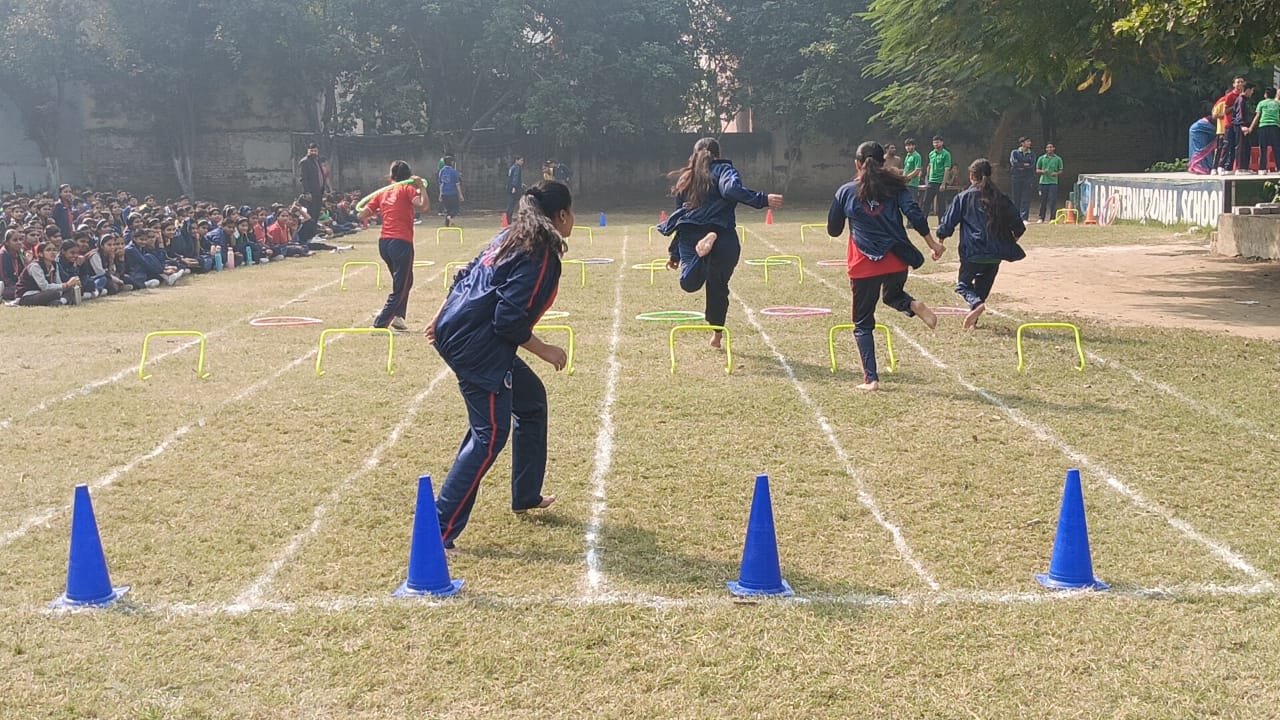 Students racing on sports field